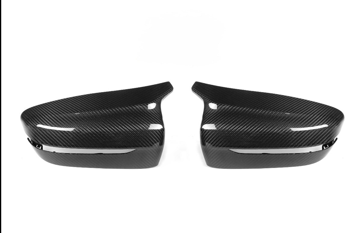 CPG + F9X Style Carbon Spiegelkappen im Paar mit markanter Formgebung und glänzender Oberfläche passend für BMW G30 G31 G32 G11 G12 G14 G15 G16